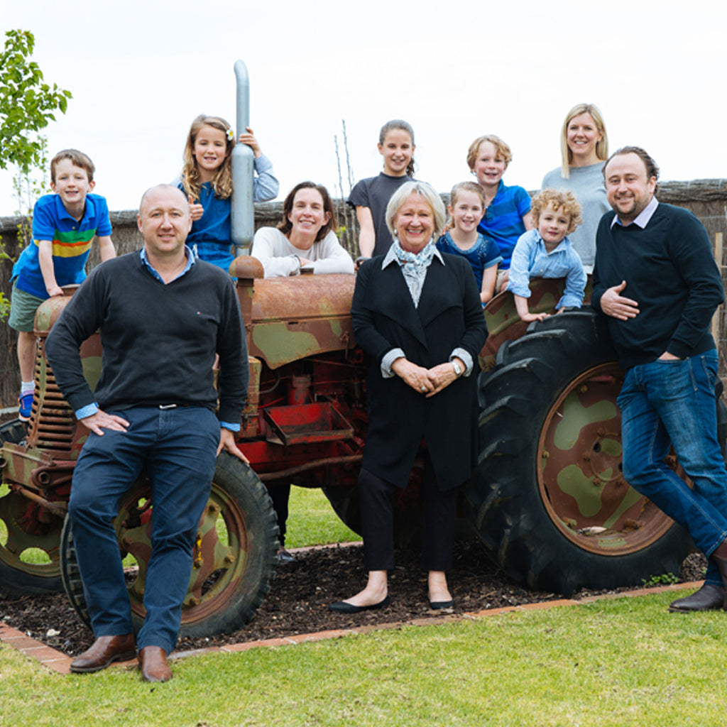 Several Generations of the Ashmead Family of Elderton Wines Posing for Picture on Old Tractor