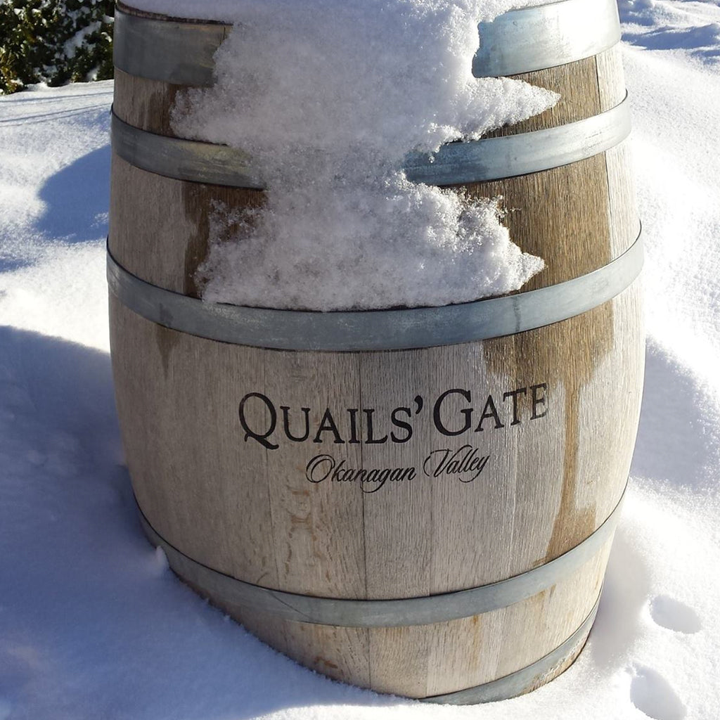 Quails' Gate wine barrel covered in snow