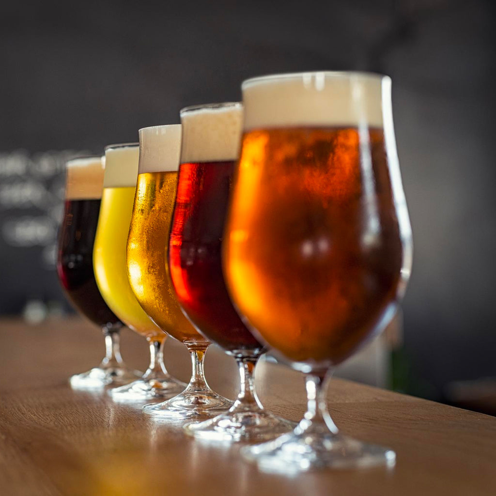 Glasses of Beer, Lager, Ale & Cider on Bar Top