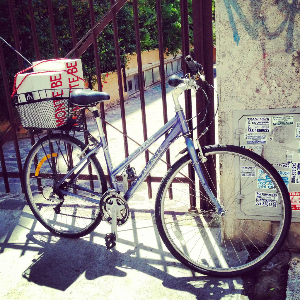 Monte Bernardi Delivery Bicycle leaned up against gates