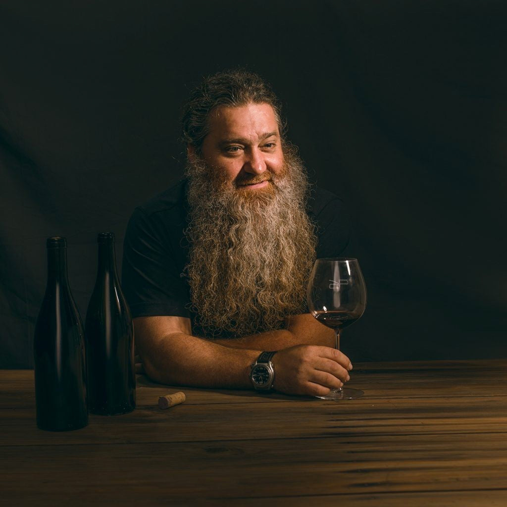 Winemaker Raúl Peréz sat at a table with Wine Glass in hand