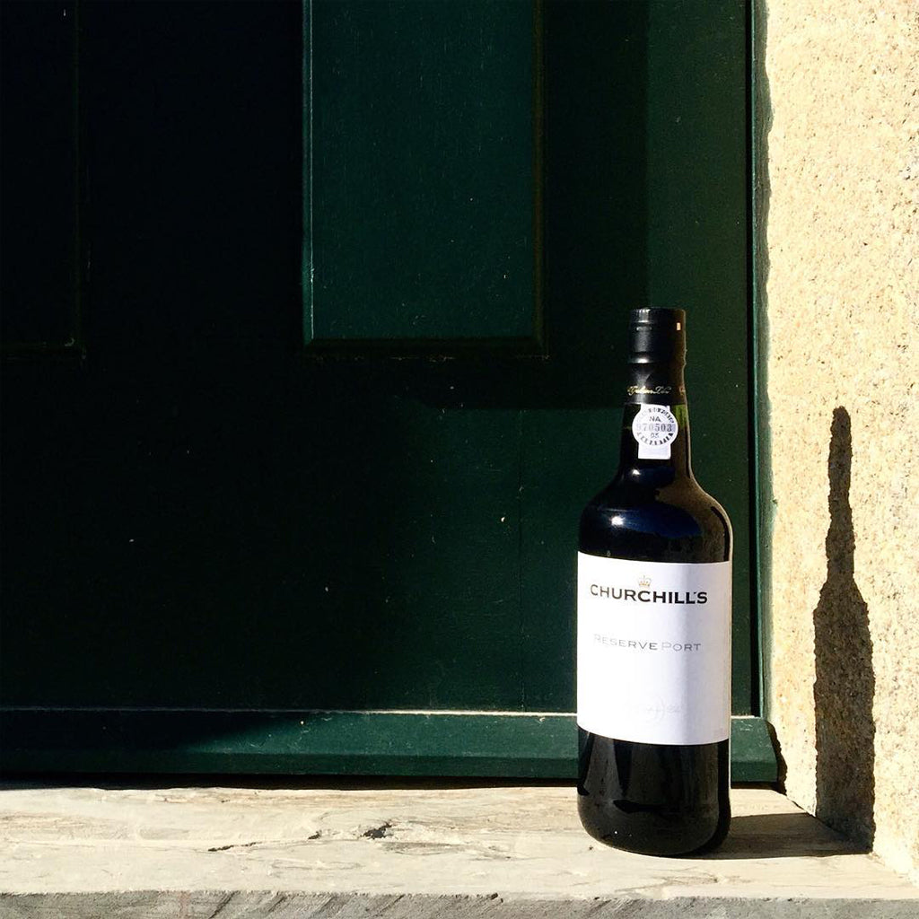 Bottle of Churchill's Port on a sunlit doorstep
