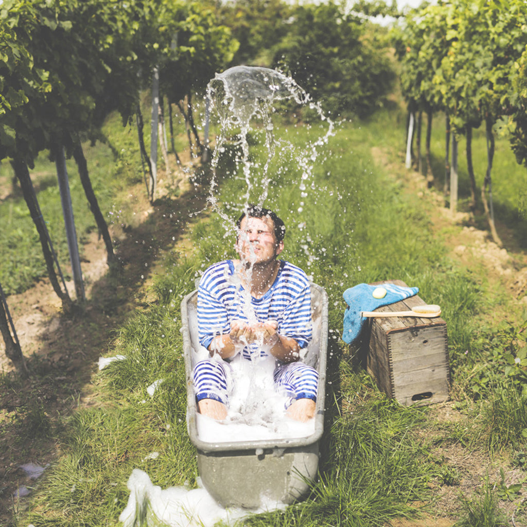 Arnold Holzer taking a bath in the vineyards