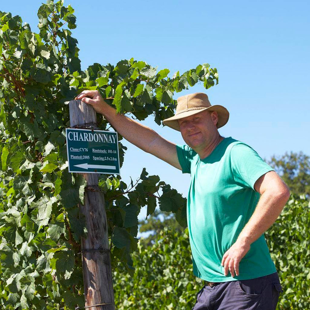 Richard Kershaw next to Chardonnay vines in Elgin, South Africa