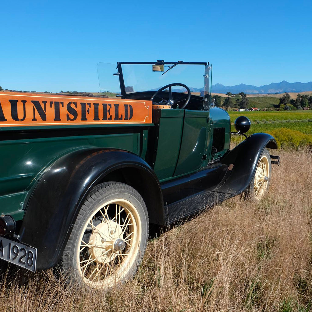 Old open top truck with Auntsfield written on the side