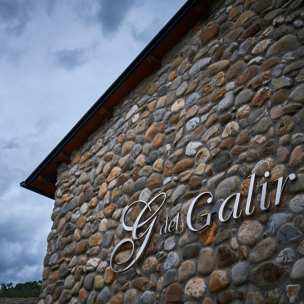 Sign on the side of Virgen del Galir Stone Winery Building