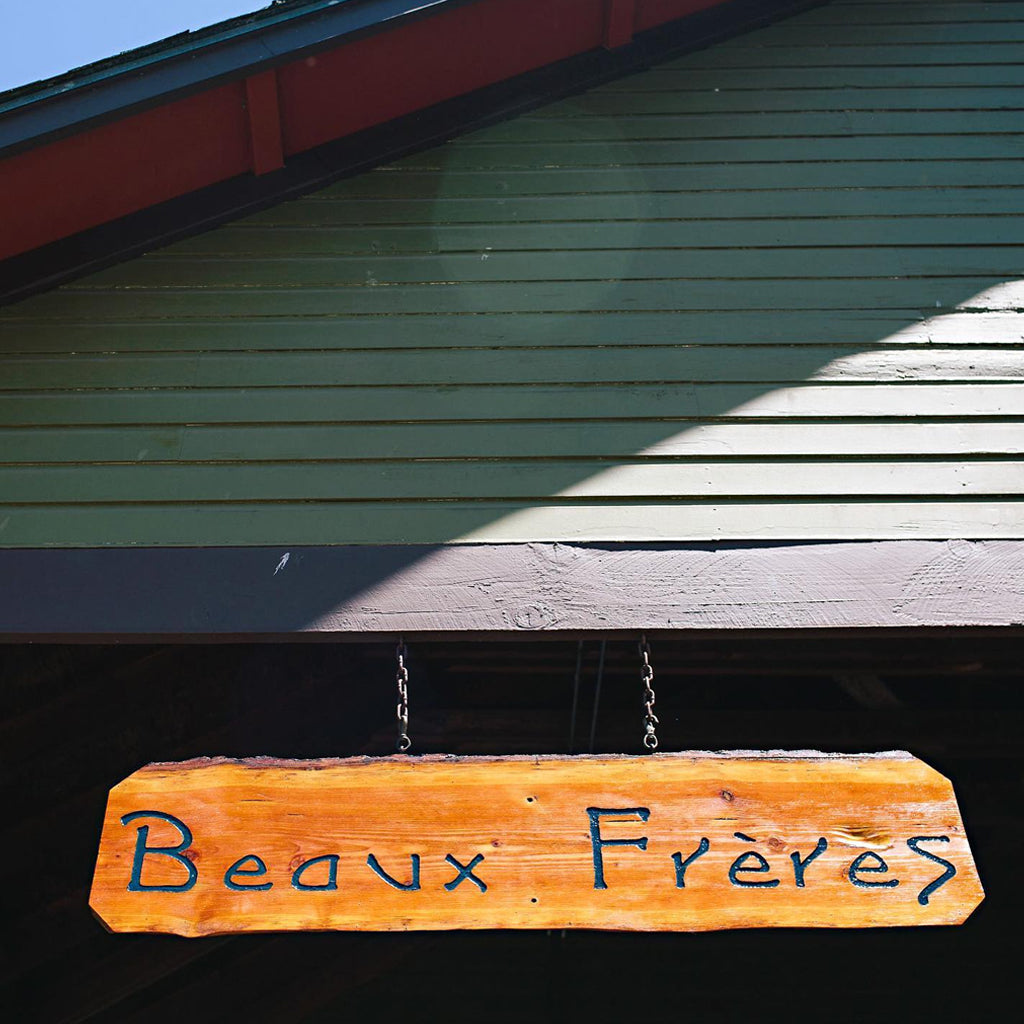 Beaux Frères Hanging Wooden Sign on Winery Building