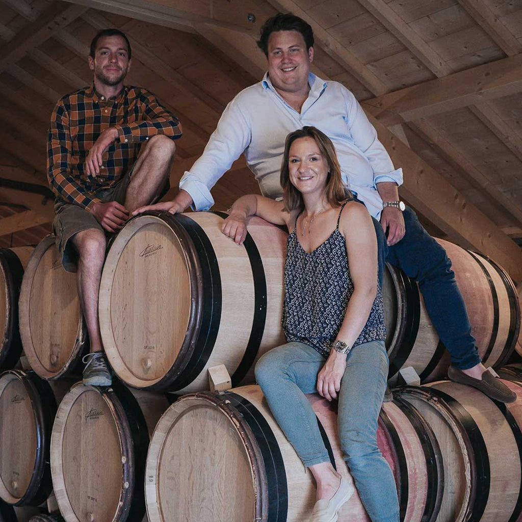 The Domaine Georges Joillot Family sat on barrels in their cellar